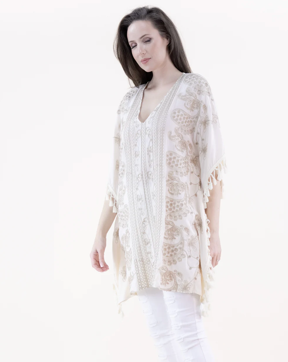 Woman wearing a white lace top on a white background