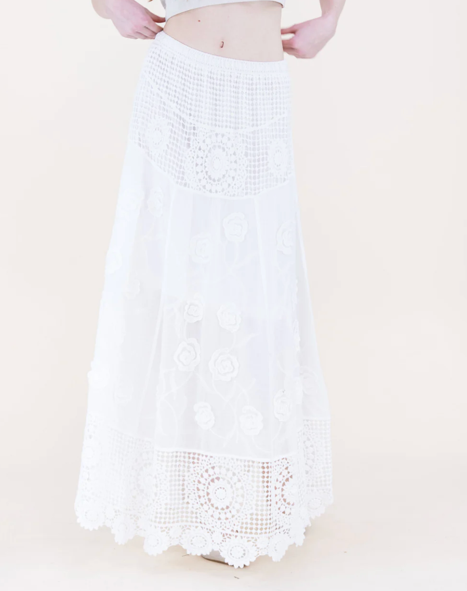 White crochet skirt with a beige background