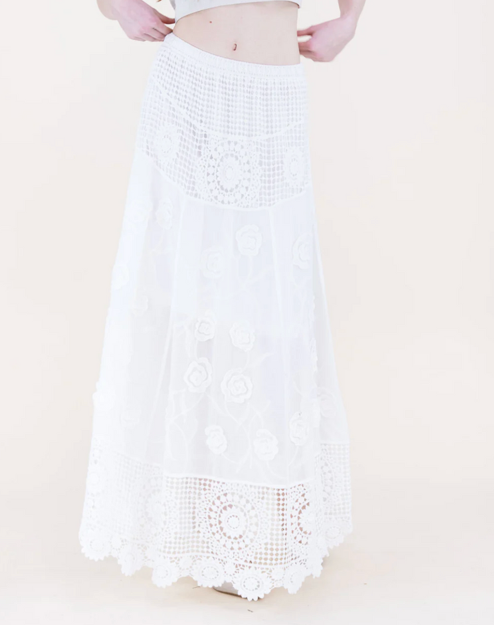 White crochet skirt with a beige background