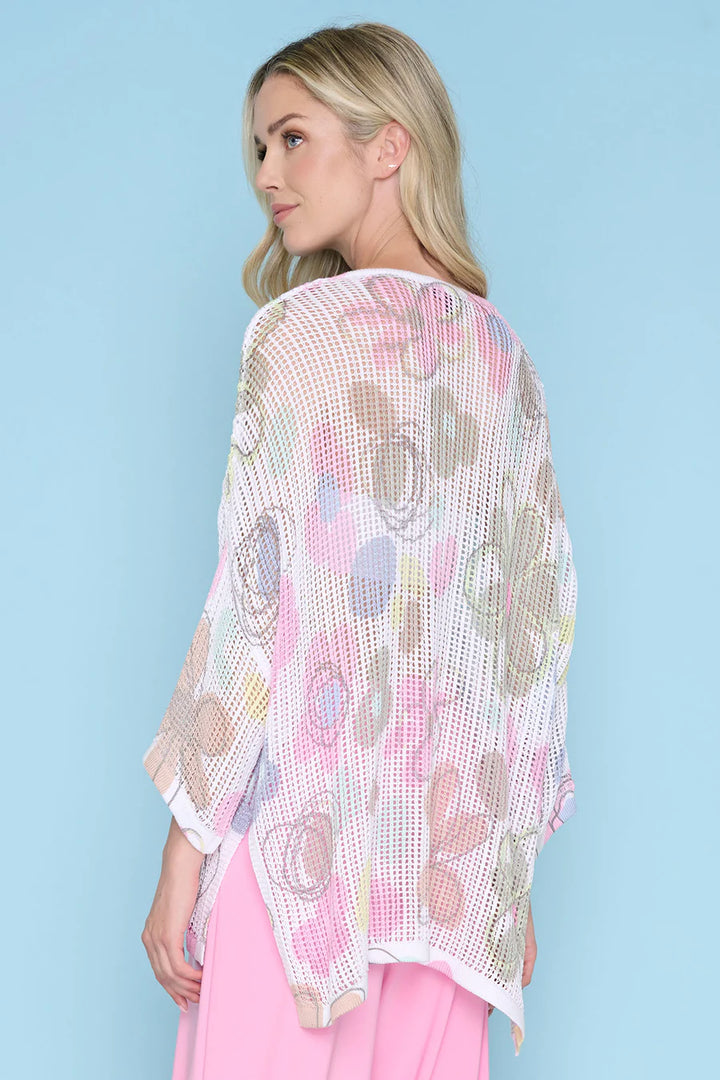 Woman wearing a floral kimono against a light blue background