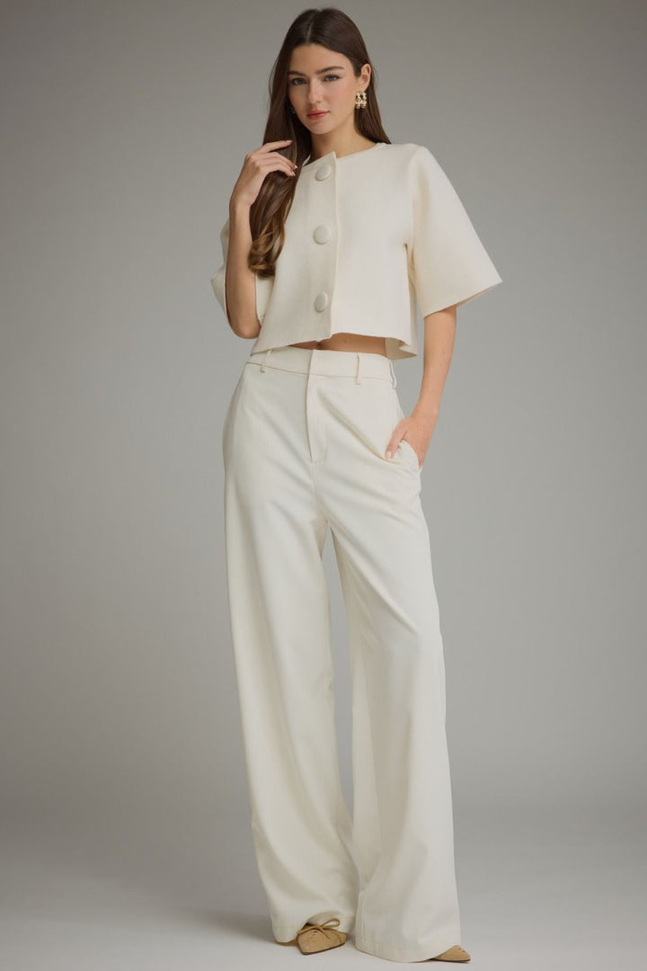 Bianca Button Cardigan in cream, full-length view styled with cream wide-leg pants