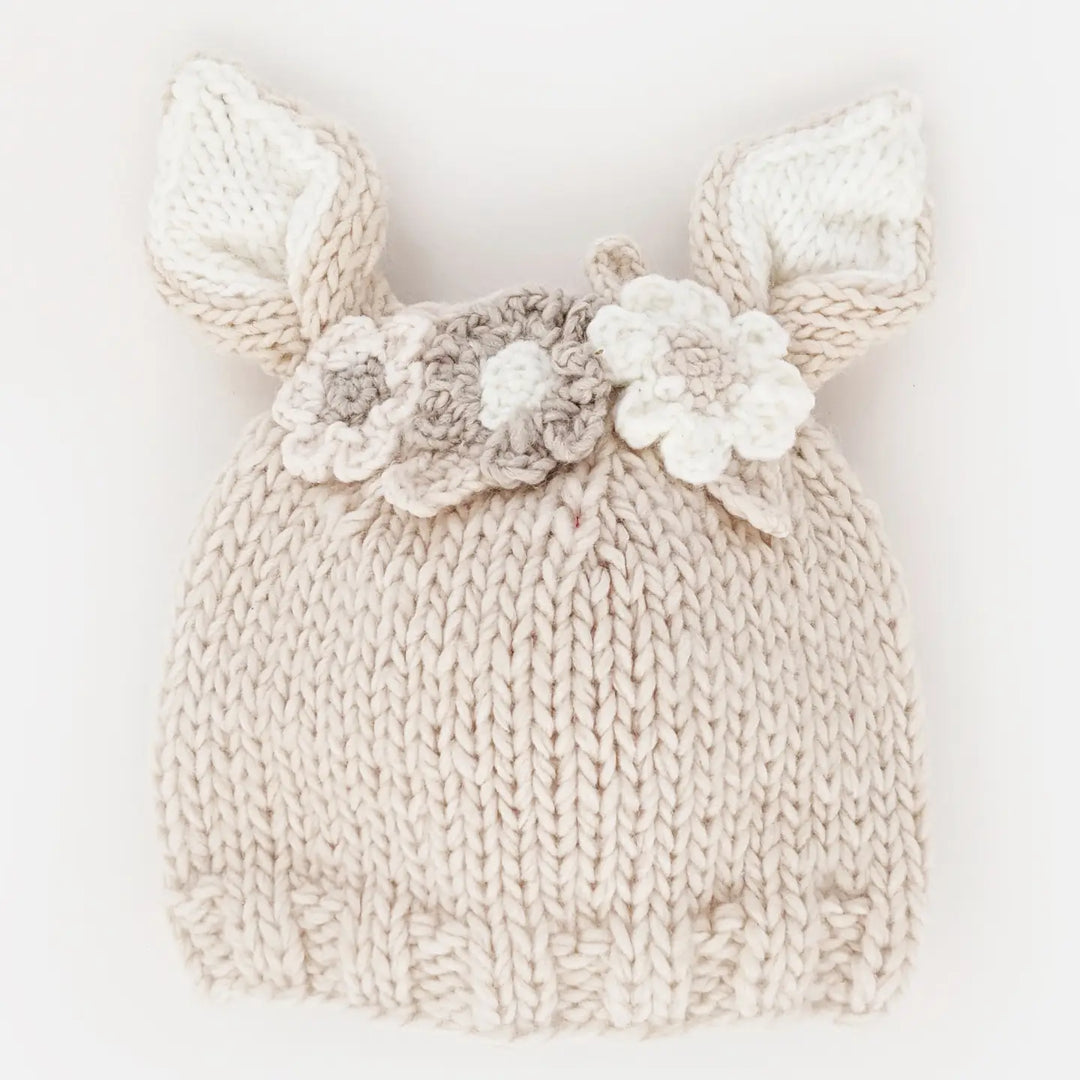 Natural hand-knit Blossom Bunny Baby Hat with cream-lined bunny ears and white, natural and tan flowers
