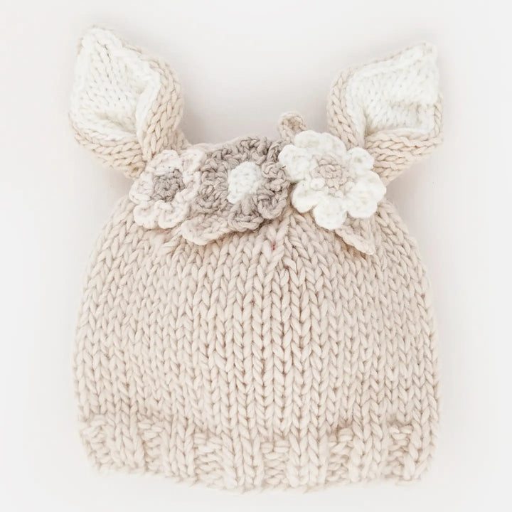 Natural hand-knit Blossom Bunny Baby Hat with cream-lined bunny ears and white, natural and tan flowers