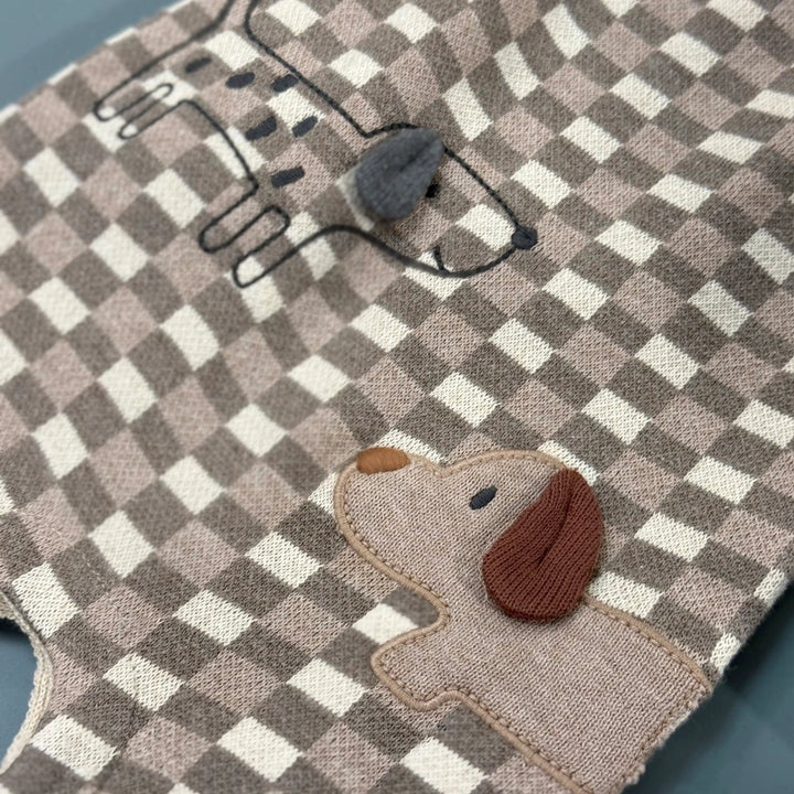 3D embroidered dog with textured ears on brown checkered baby overalls