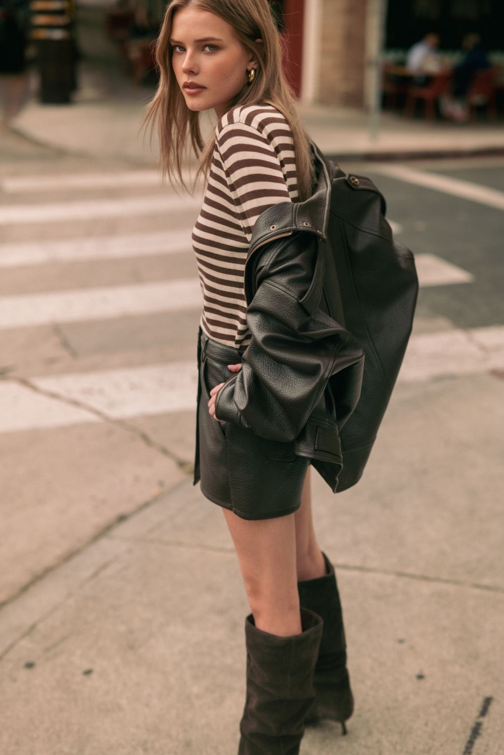 Chocolate Faux Leather Jacket in chocolate brown, lifestyle view worn off the shoulder