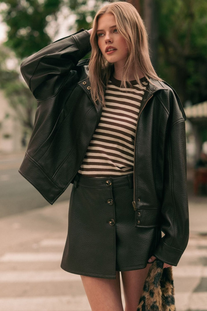 Chocolate Faux Leather Jacket in chocolate brown, lifestyle view worn open over a striped tee