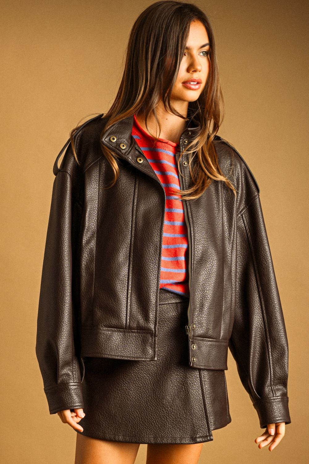 Chocolate Faux Leather Skort in chocolate brown, close-up with the matching jacket