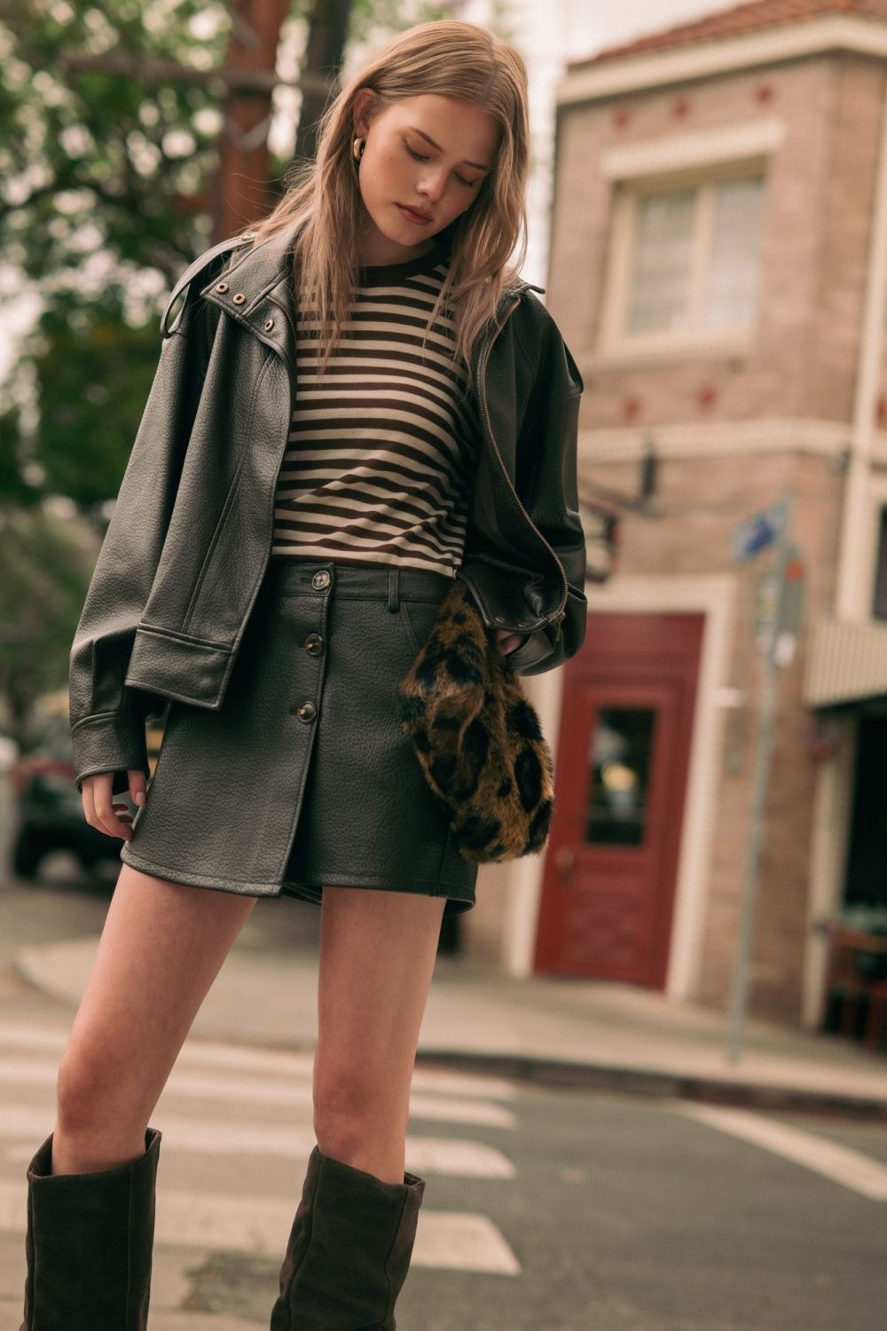 Chocolate Faux Leather Skort in chocolate brown, full-length lifestyle view styled with the matching Chocolate Faux Leather Jacket
