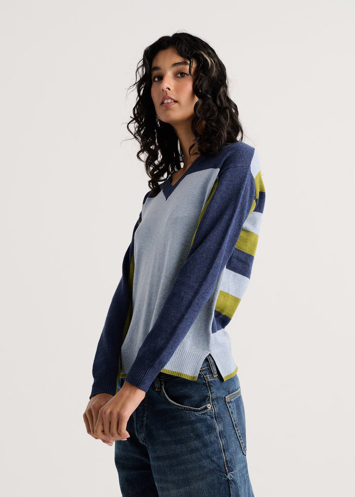 Color Theory V-Neck Sweater side view showing navy sleeve and striped back