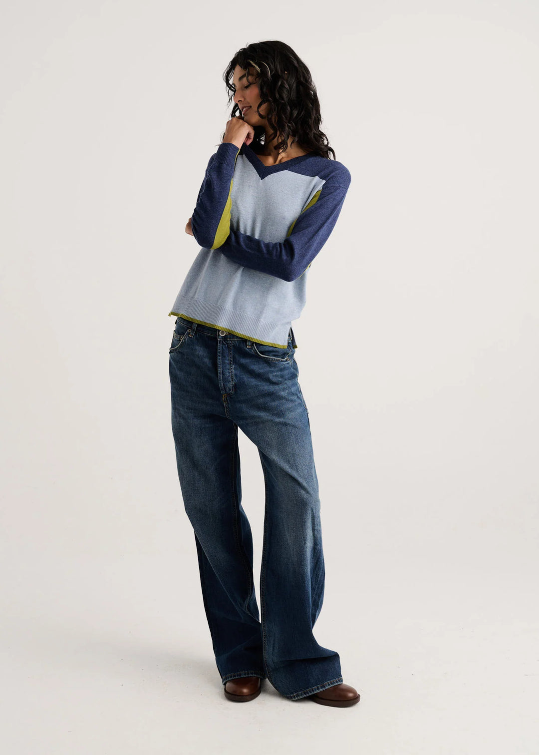 Color Theory V-Neck Sweater styled with wide-leg jeans