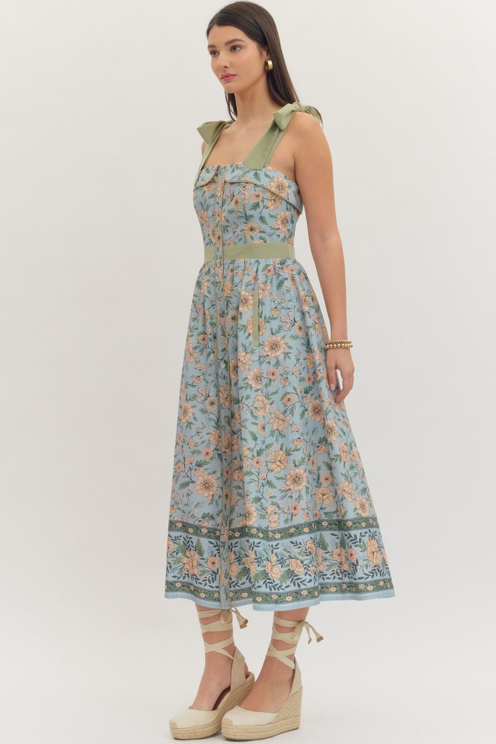 Woman wearing a floral dress on a white background