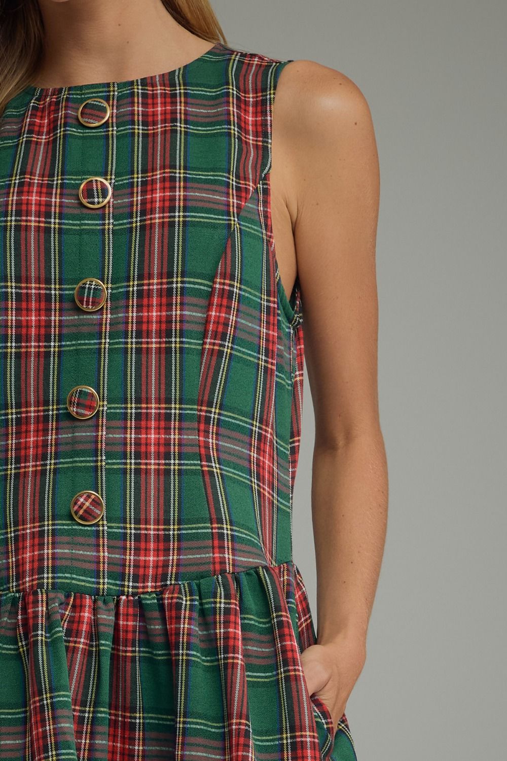 Tartan Belle Sleeveless Dress in green tartan, close-up of button front and drop waist