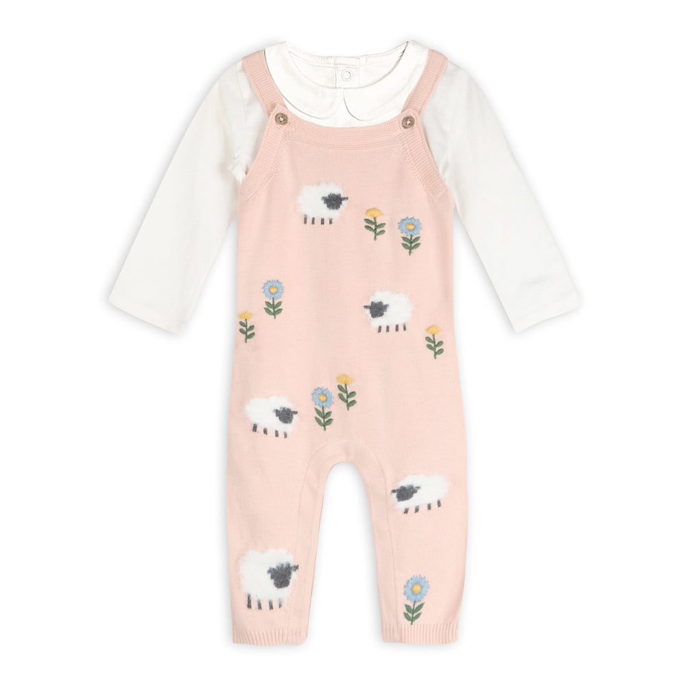 Pink knit baby overalls with lamb and floral pattern over a white long-sleeve bodysuit romper