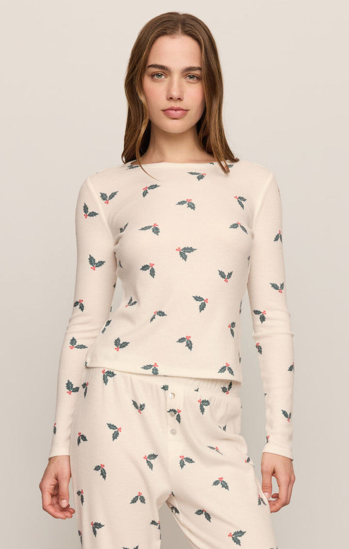 Woman wearing the Z Supply Holly Jolly Waffle Fitted Top in Vanilla Ice holly print, front view