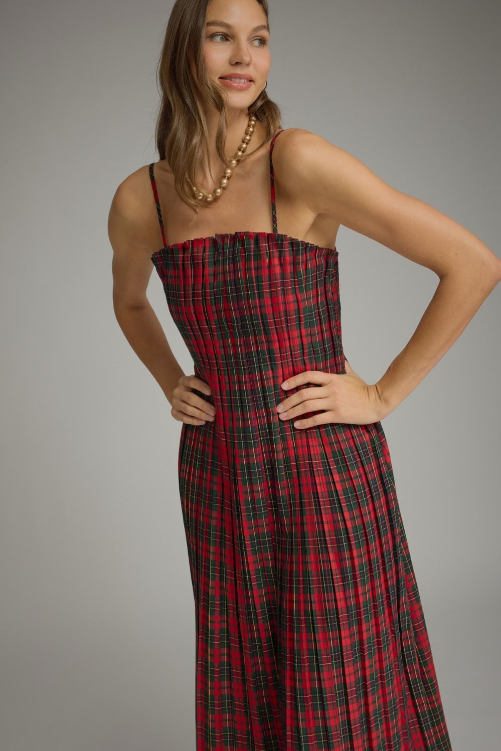 Holly Plaid Pleated Midi Dress in red plaid, close-up of pleated bodice and spaghetti straps
