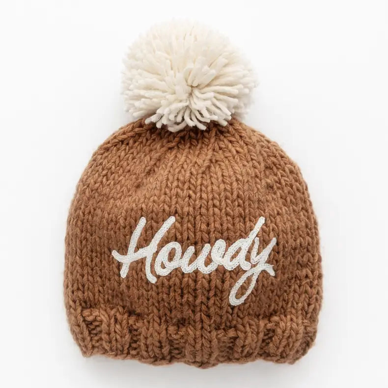 Pecan brown hand-knit Howdy Baby Hat with white embroidered Howdy script and cream pom pom
