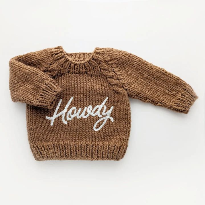 Pecan brown hand-knit Howdy Baby Sweater with white embroidered Howdy script and raglan sleeves