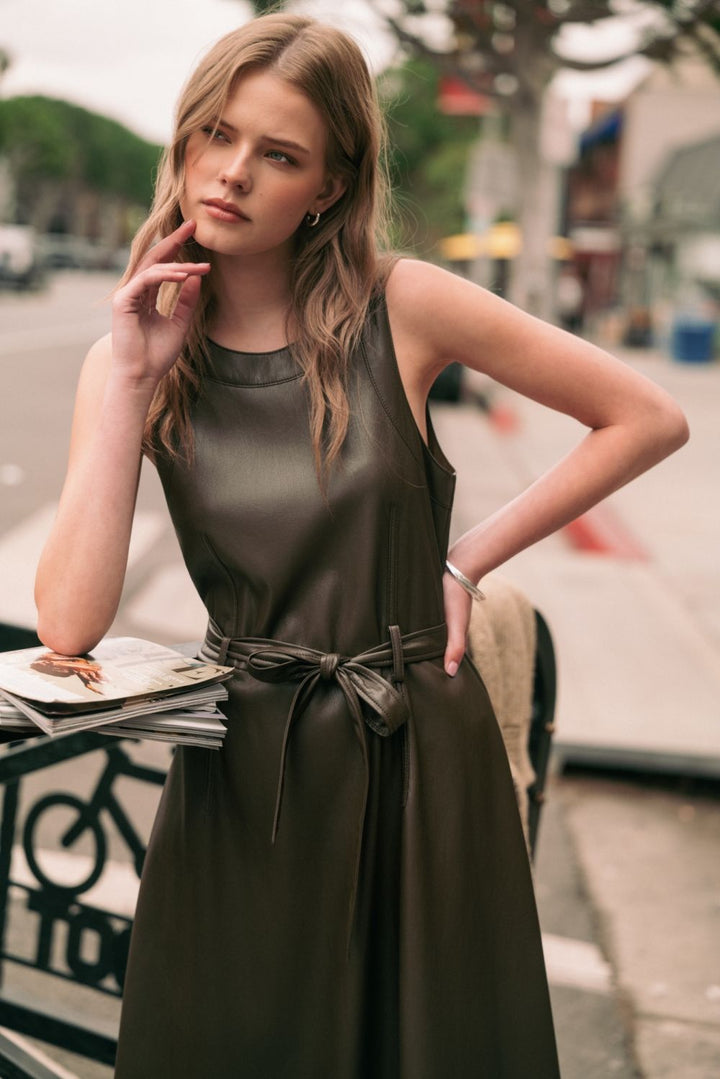 Laurel Belted Faux Leather Dress in mocha, lifestyle view on the street