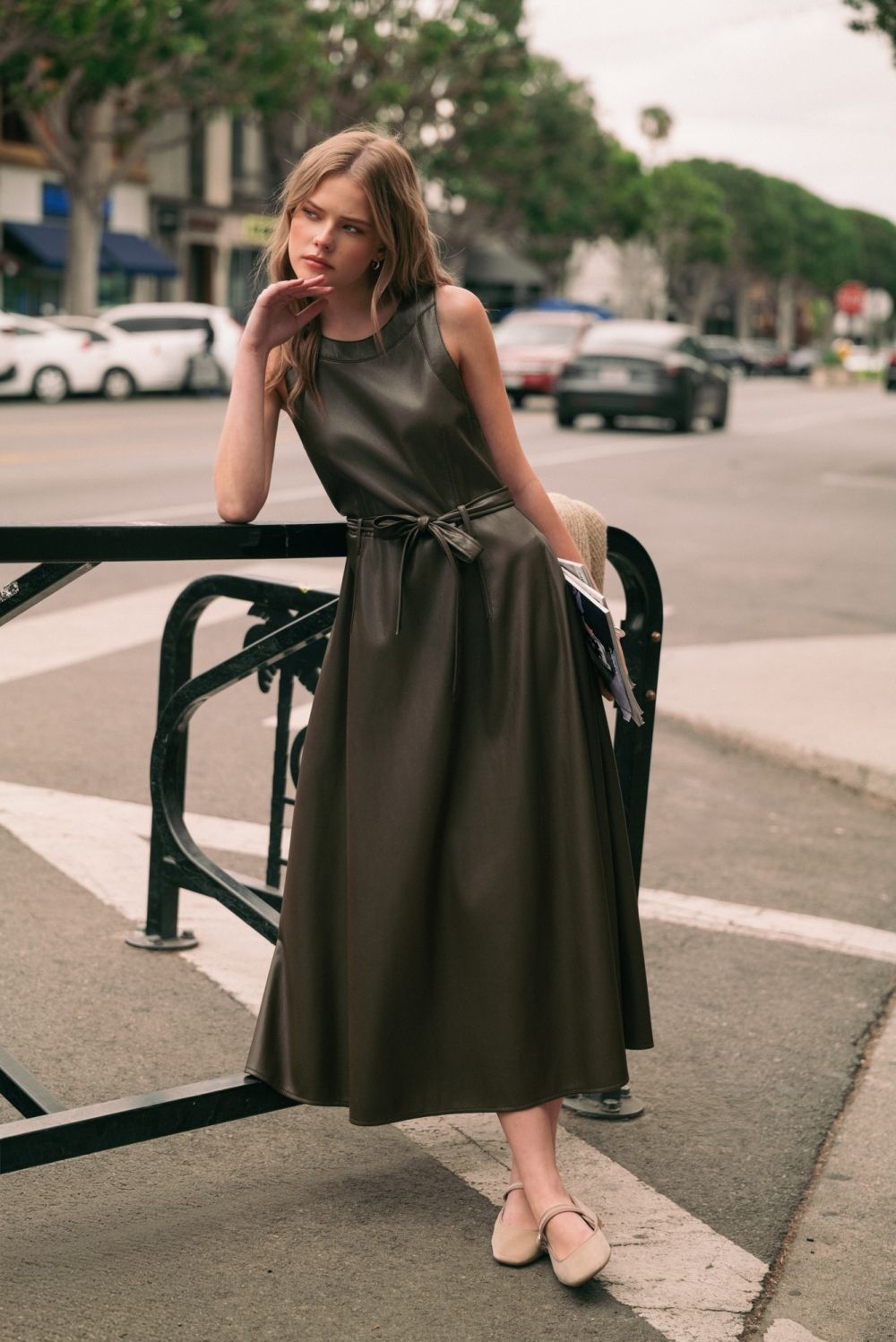 Laurel Belted Faux Leather Dress in mocha, lifestyle view showing tie belt