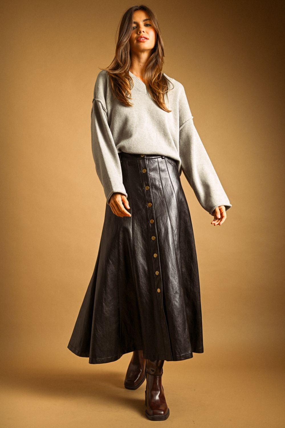 Maxine Faux Leather Skirt in black, full-length view styled with a grey sweater