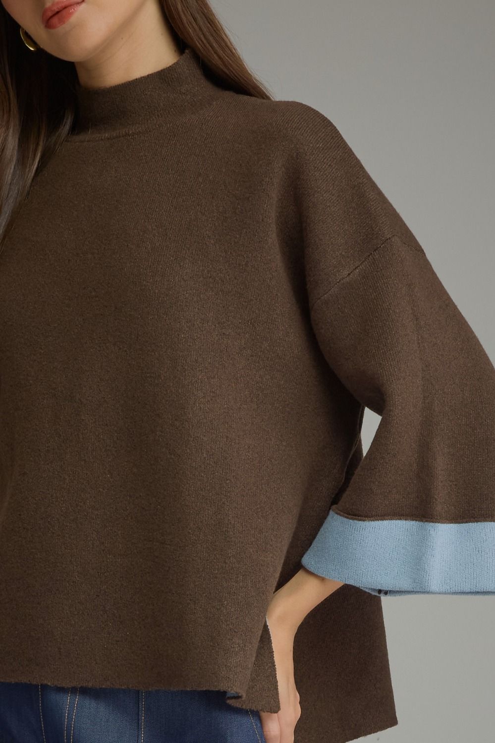 Mochaccino Mock Neck Sweater in brown, close-up of mock neck and light blue cuff