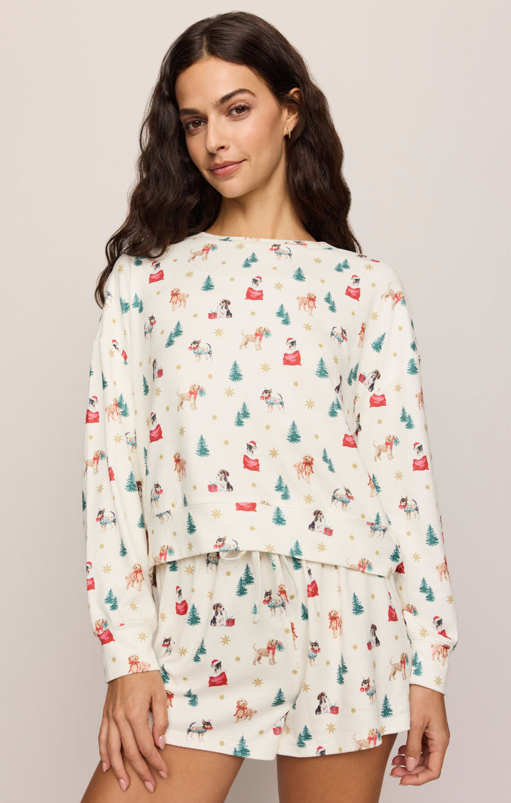 Woman wearing the Z Supply Pawfect Long Sleeve Pajama Top in Vanilla Ice holiday dog print, front view