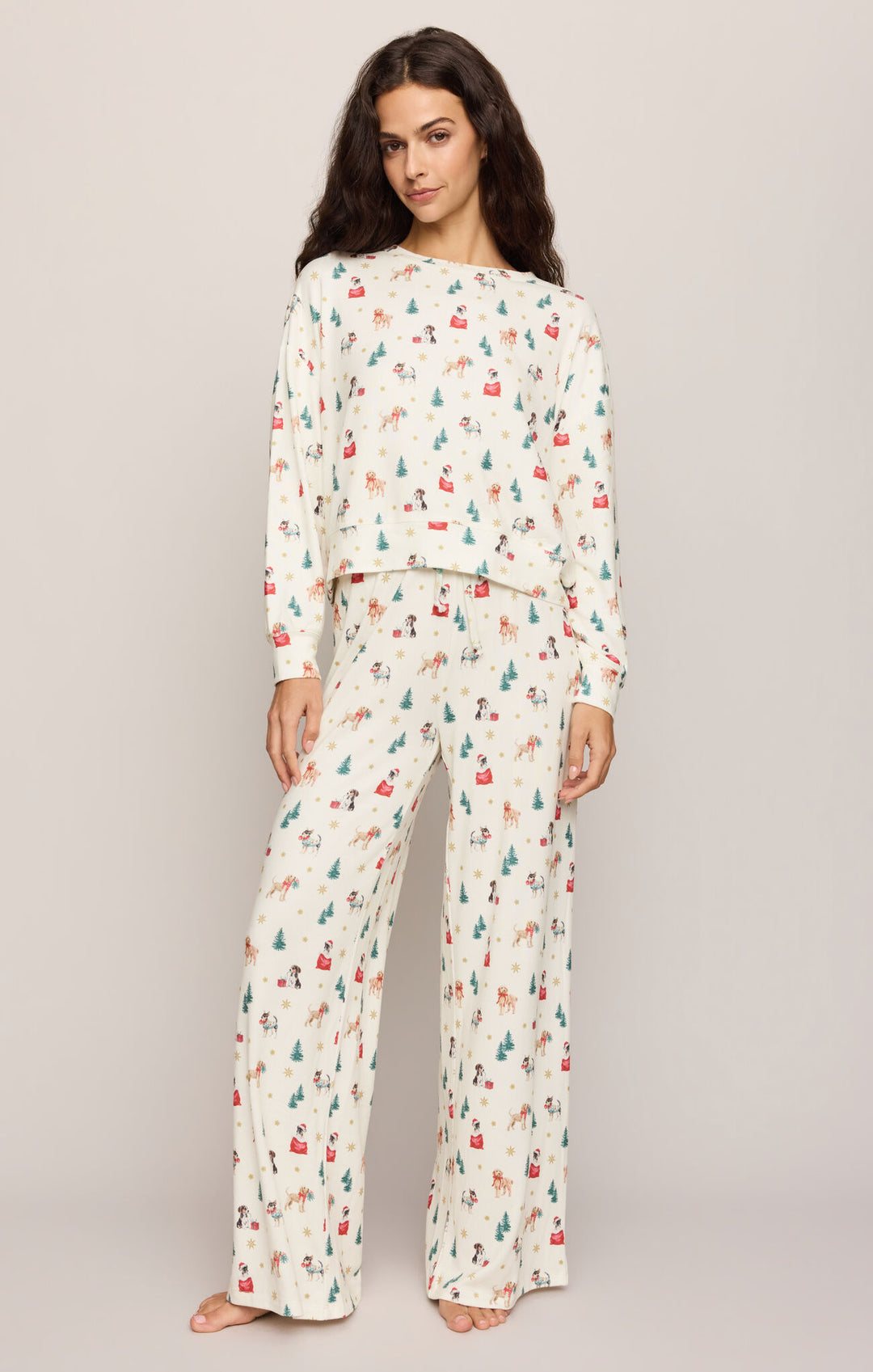 Woman wearing the Z Supply Pawfect Pajama Pant and matching top in Vanilla Ice holiday dog print