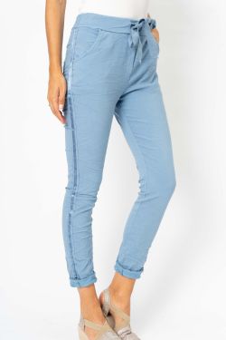 Light blue pants with a tie waist on a white background