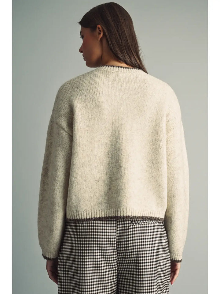 Reindeer Games Pocket Cardigan in oatmeal with brown trim, back view