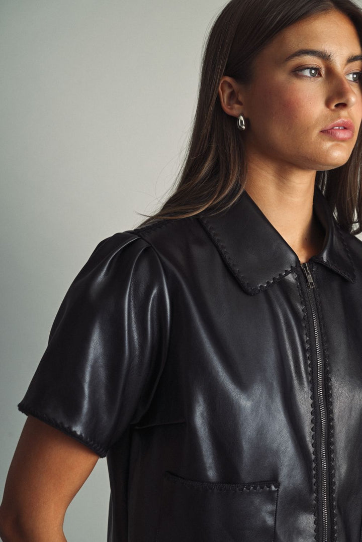 Rhodes Faux Leather Zip Top in black, close-up of collar and zip front