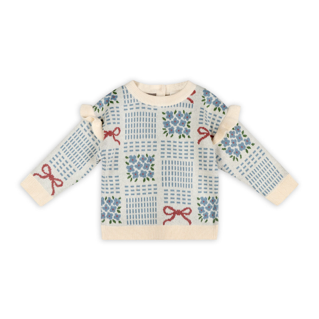 Ecru baby jacquard sweater with blue floral bouquets, red ribbon bows, ruffle shoulders, and cream ribbed trim
