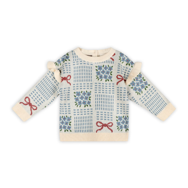 Ecru baby jacquard sweater with blue floral bouquets, red ribbon bows, ruffle shoulders, and cream ribbed trim