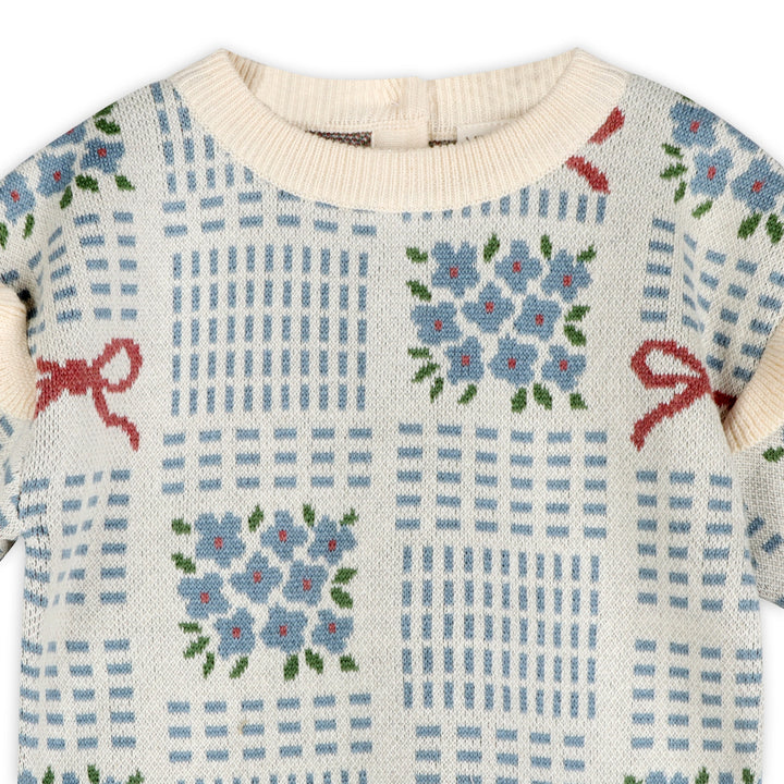 Blue floral and red bow jacquard knit detail on the Ribbon &amp; Bow Baby Sweater