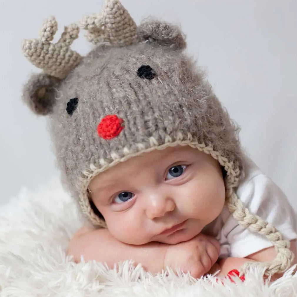 Baby wearing the fuzzy brown Rudolph Baby Hat with antlers and a red nose