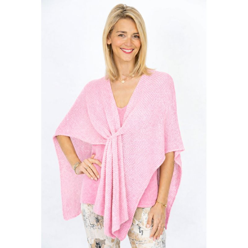 Woman wearing a pink wrap over a white background