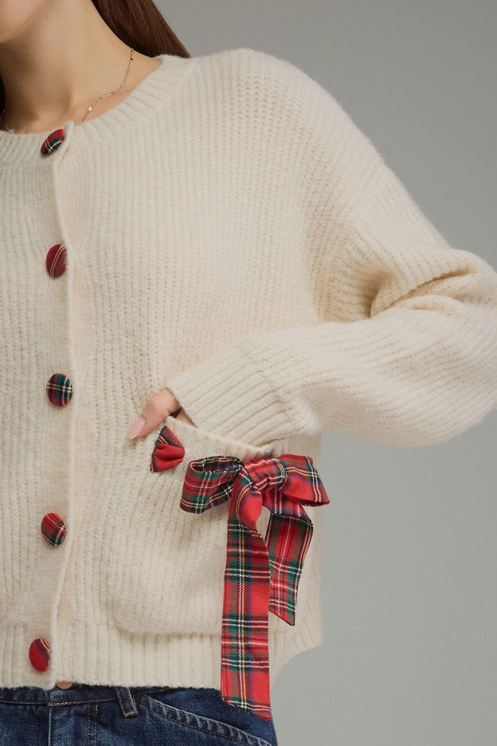 Tied Up in Tartan Bow Cardigan in cream, close-up of plaid buttons and bow pocket