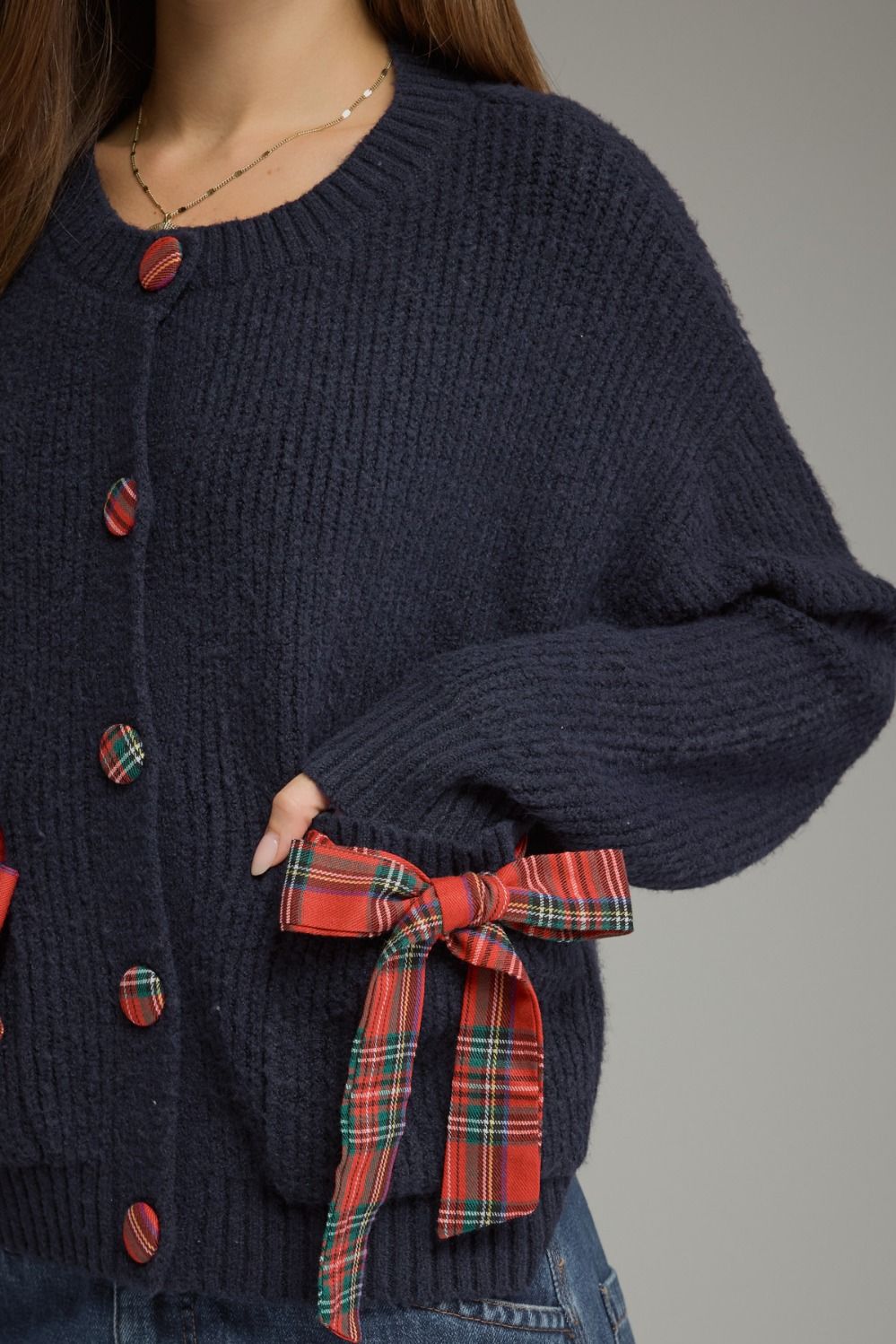 Tied Up in Tartan Bow Cardigan in navy, close-up of plaid bow pocket and tartan buttons