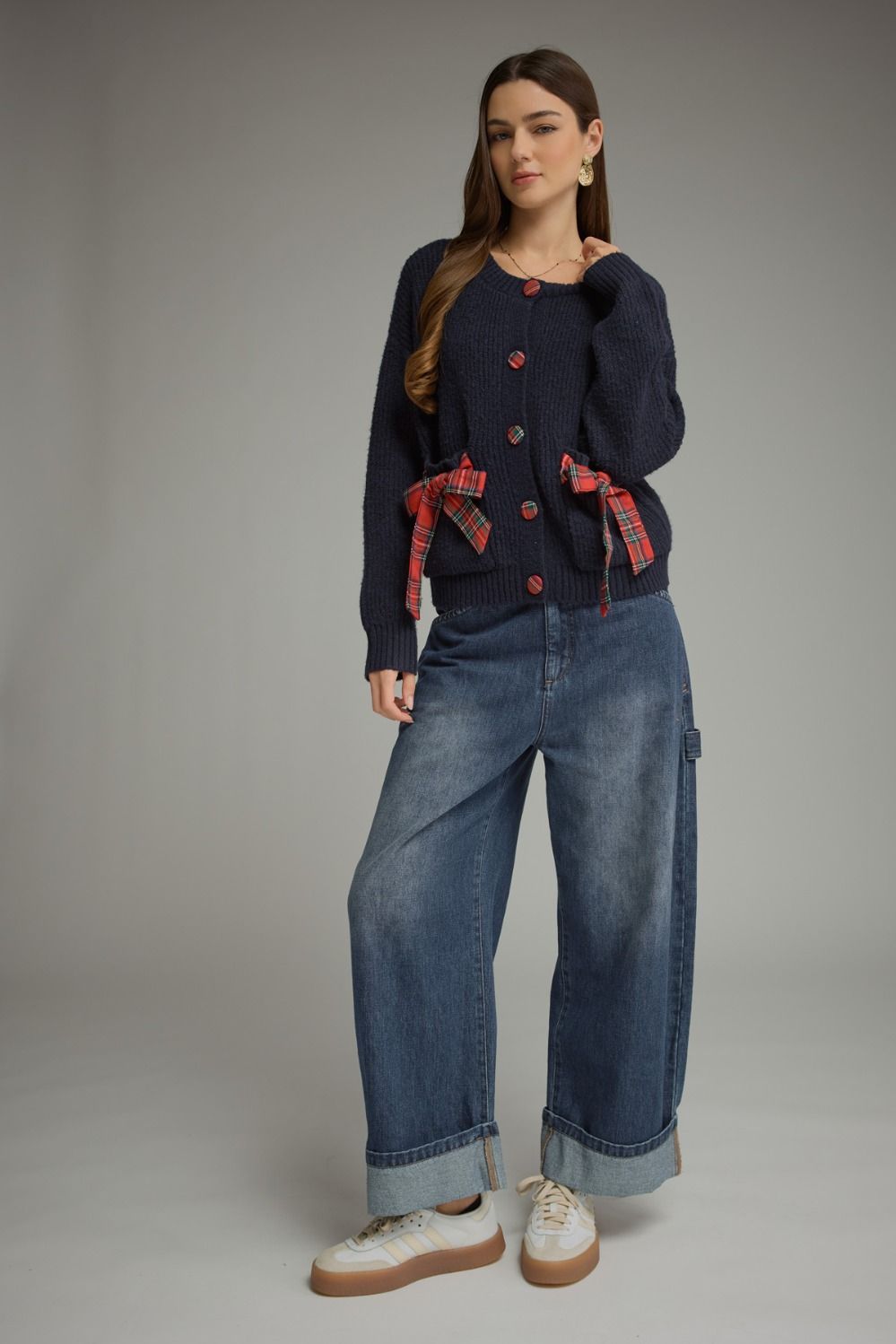 Tied Up in Tartan Bow Cardigan in navy, full-length view styled with wide-leg jeans