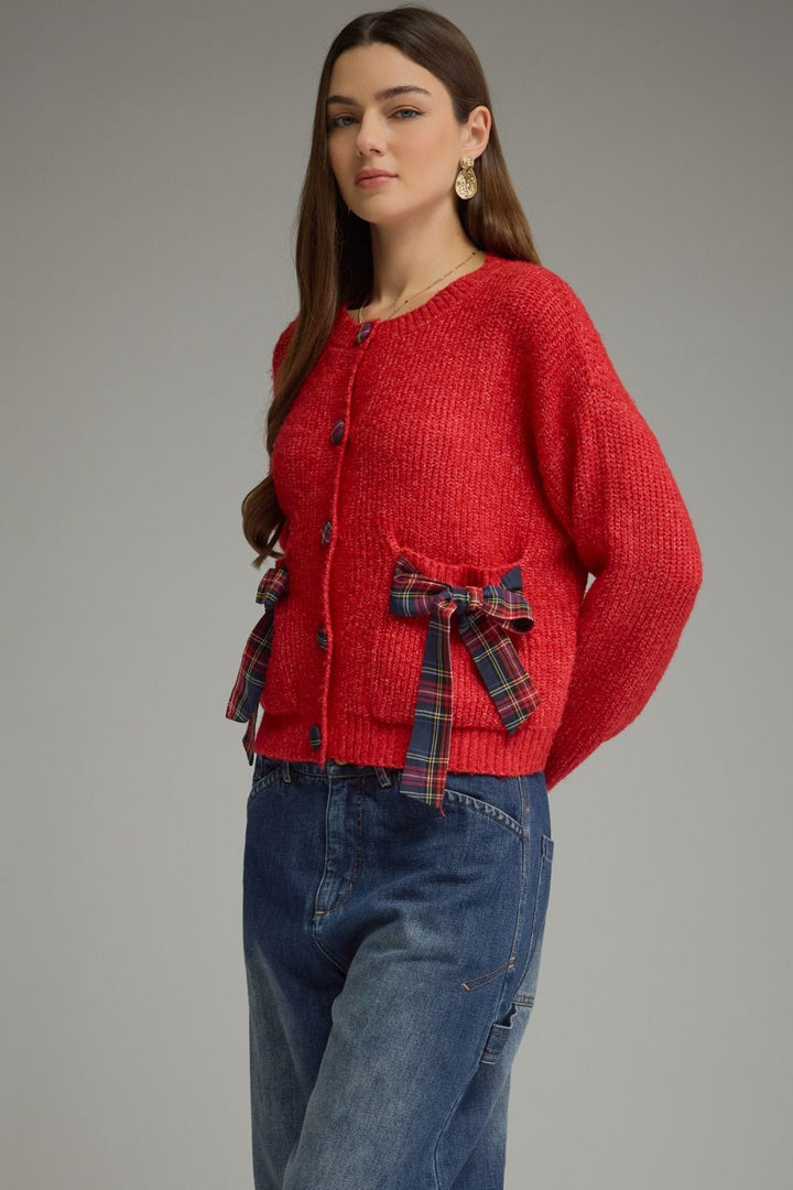 Tied Up in Tartan Bow Cardigan in red, three-quarter front view