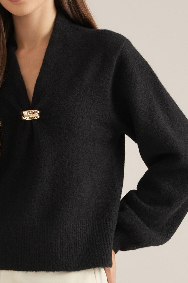Vivienne Gold Clasp Collared Sweater in black, close-up of gold clasp and wide collar