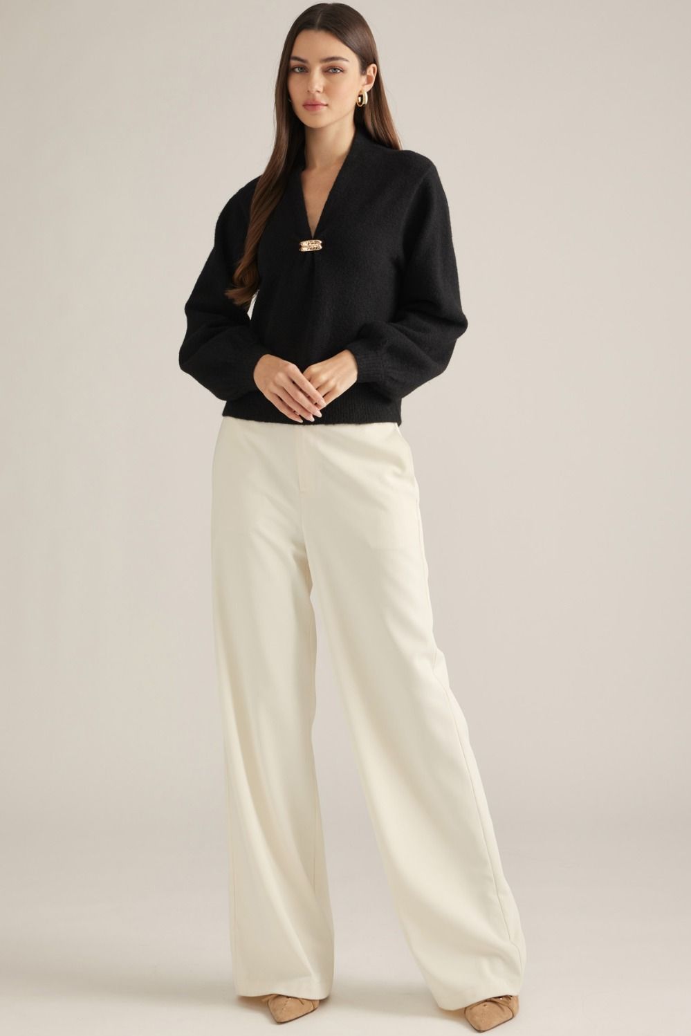 Vivienne Gold Clasp Collared Sweater in black, full-length view styled with cream wide-leg pants