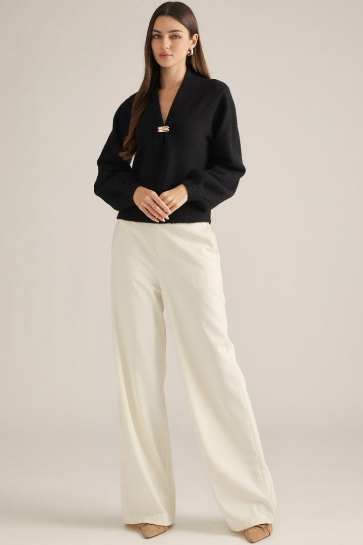 Vivienne Gold Clasp Collared Sweater in black, full-length view styled with cream wide-leg pants
