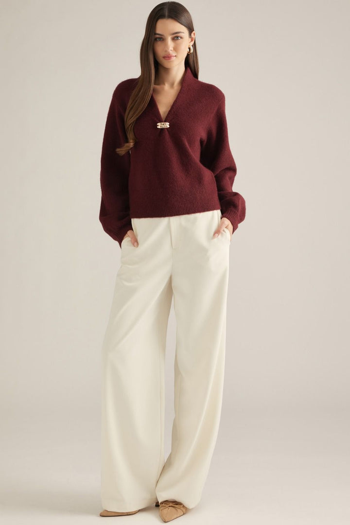 Vivienne Gold Clasp Collared Sweater in burgundy, full-length view styled with cream wide-leg pants